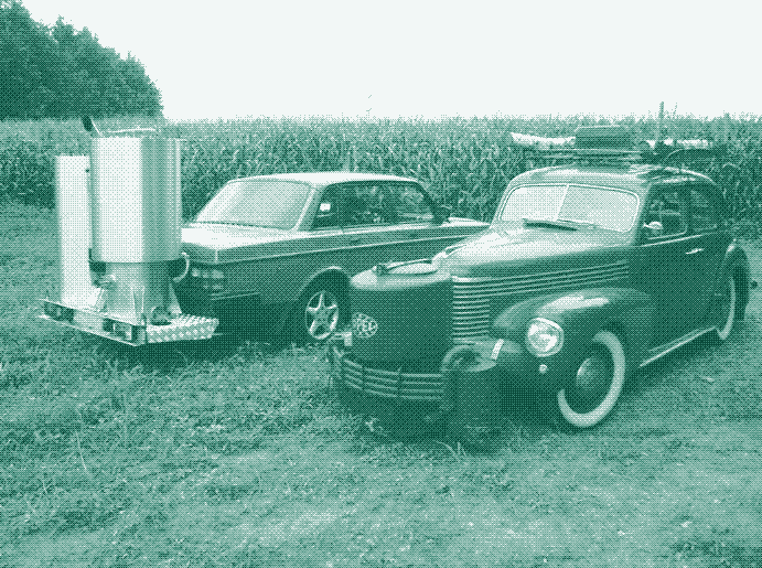 Image: A newly built wood gas car, parked next to a wood gas vehicle from the 1940s. Image: Dutch John.