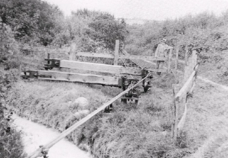 Two lines of flat rods at Carloggas in 1938. These rods were led round a small angle by single-arm fend-off bobs, whose outer ends had a small wheel on a curved rail. Image: &ldquo;Steam engines and waterwheels: a pictorial study of some early mining machines&rdquo;.