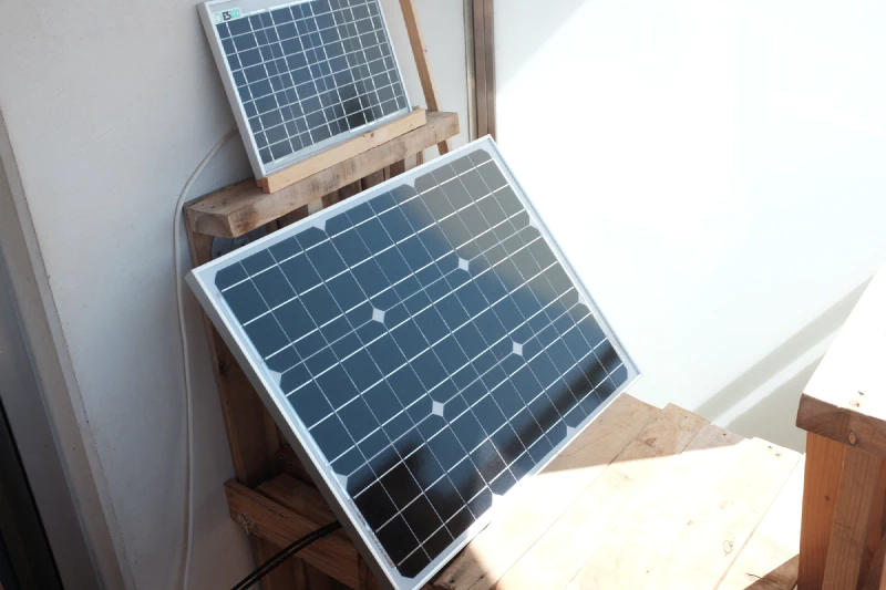 The 50W solar PV panel. On top of it is a 10W panel powering a lighting system.