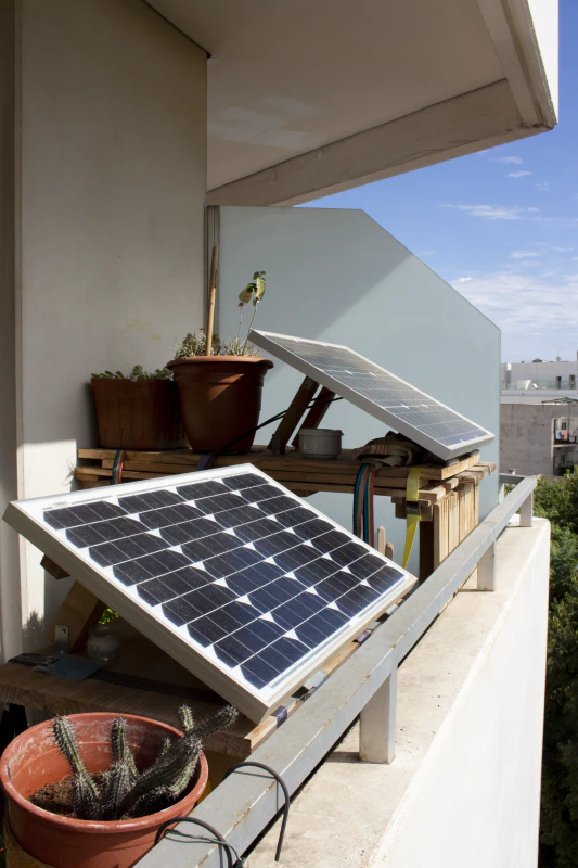 The 50W and 30W solar PV panels on the balcony. One is powering the website, the other is powering the lights in the living room. Image by Marie Verdeil.