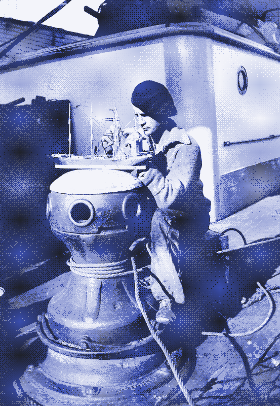 Crewman of the &lsquo;Parma&rsquo; with a model of his ship. Alan Villiers, 1932-33.