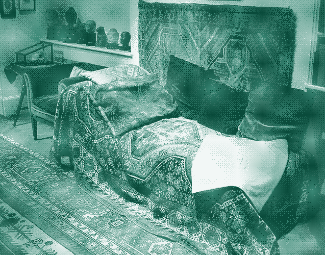 Image: Sigmund Freud’s couch in the Freud Museum London. The room features a floor carpet, wall carpet, couch carpet, and pillows. Photo credit: Robert Huffstutter (CC BY 2.0).