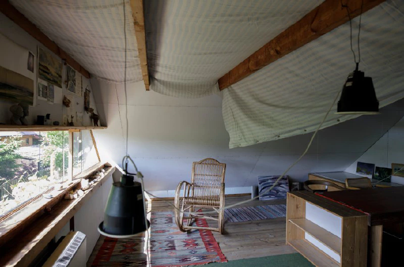 Image: Hanging an eiderdown beneath the roof of the Oskar and Zofia Hansen House in Szumin, Poland. Photograph by Michał Matejko, 2020, from “The Clothed Home” project by Alicja Bielawska, CENTRALA and Aleksandra Kędziorek, organized by the Adam Mickiewicz Institute. Republished with permission.