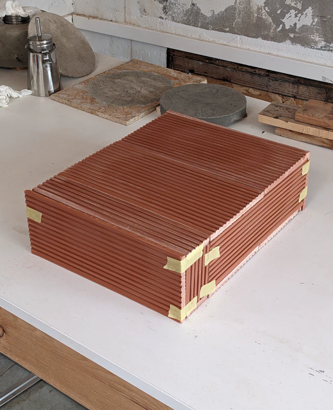 Image: The oven chamber, made from thick terracotta roof tiles. Photo by Marie Verdeil.