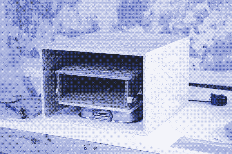 Image: The oven chamber inside the wood structure. The space in between will be filled up with cork insulation and a mortar layer at the bottom. Photo by Marie Verdeil.