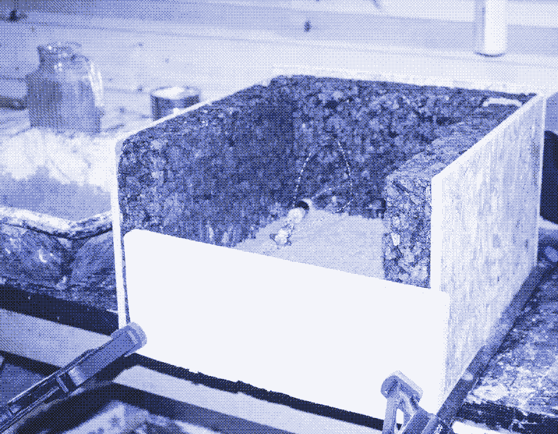 Image: The thermal switch and fuse are seen on the first layer of mortar. Photo by Marie Verdeil.