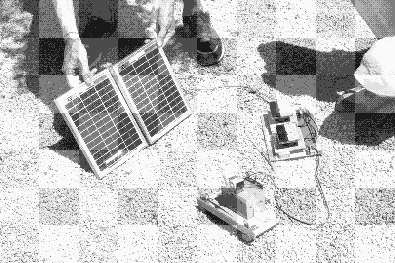 Measuring the power output of a solar panel. Photo by Marie Verdeil.